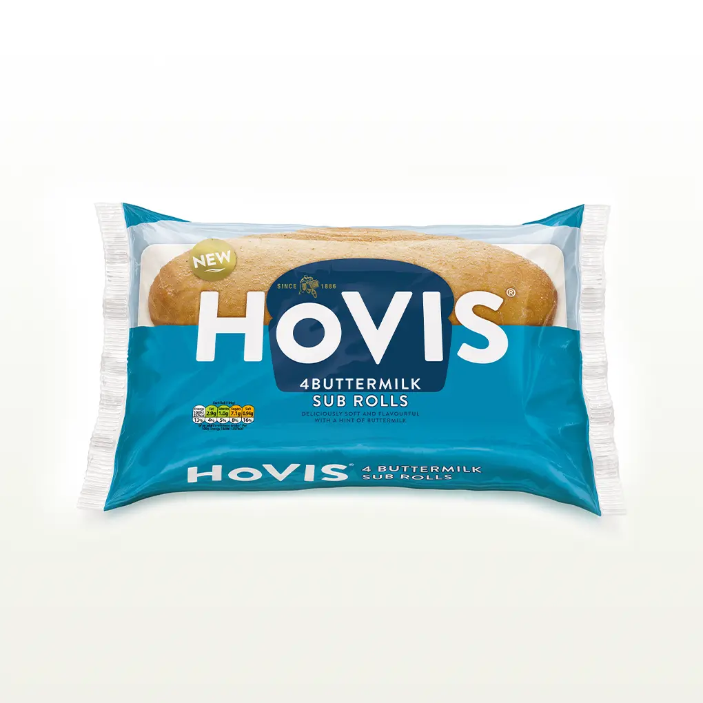 The pack shows two soft sub rolls and highlights “Deliciously soft and flavourful with a hint of buttermilk.” The pack sits on a white backdrop with a subtle shadow.