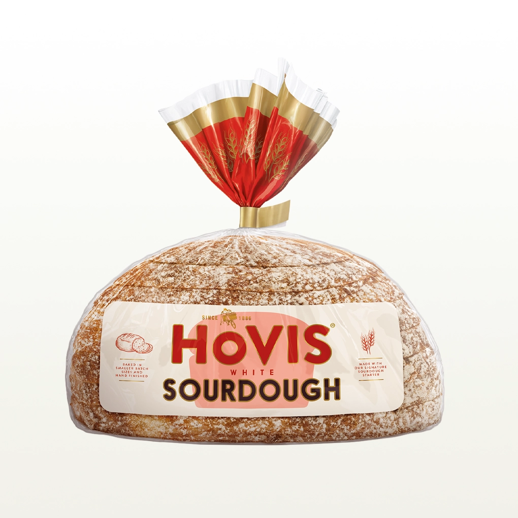 A loaf of Hovis White Sourdough sits in a cream background