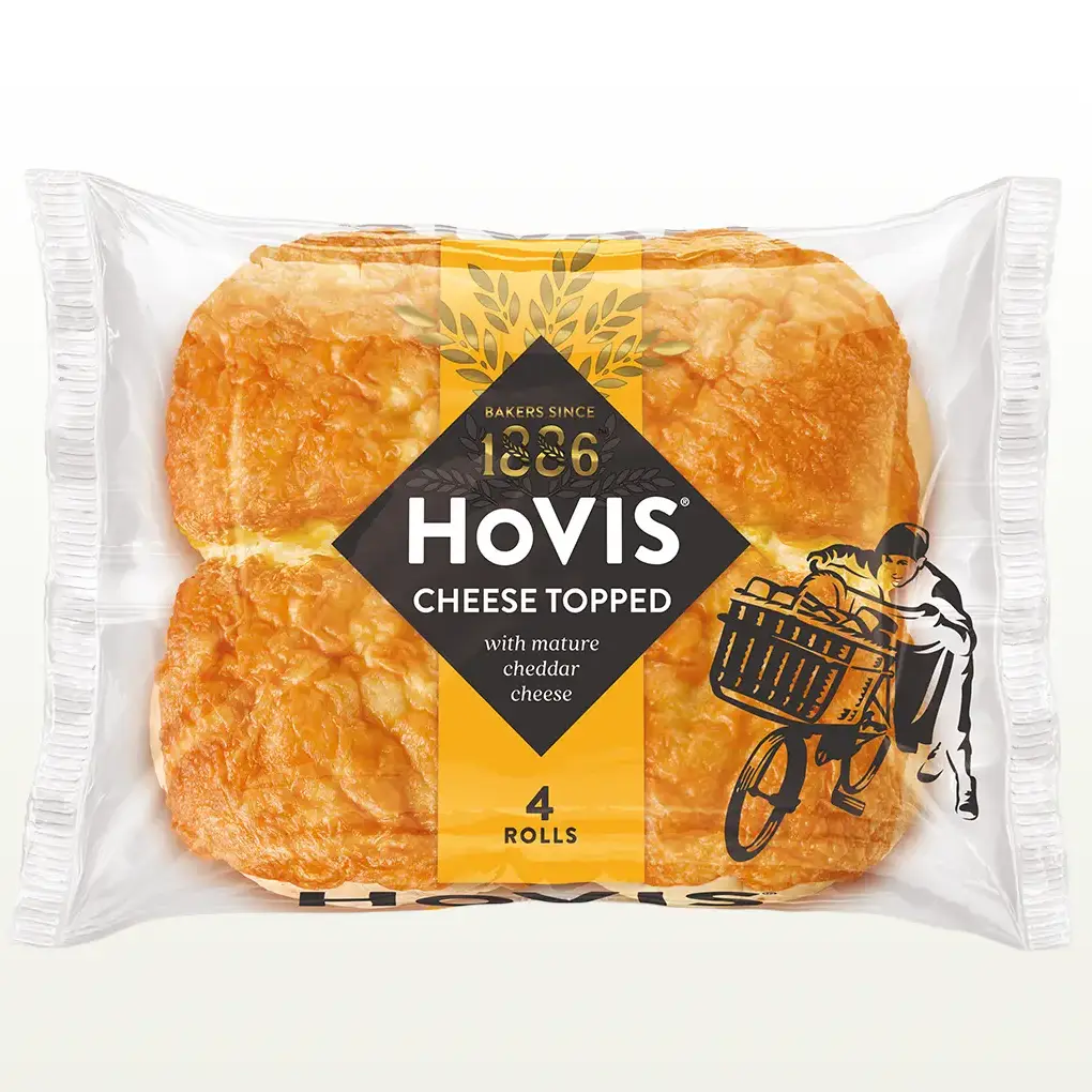 Four Hovis 4 Cheese Topped Rolls in a transparent square packaging featuring the Boy on the Bike, a yellow stripe, golden wheat, and the Hovis logo on top.